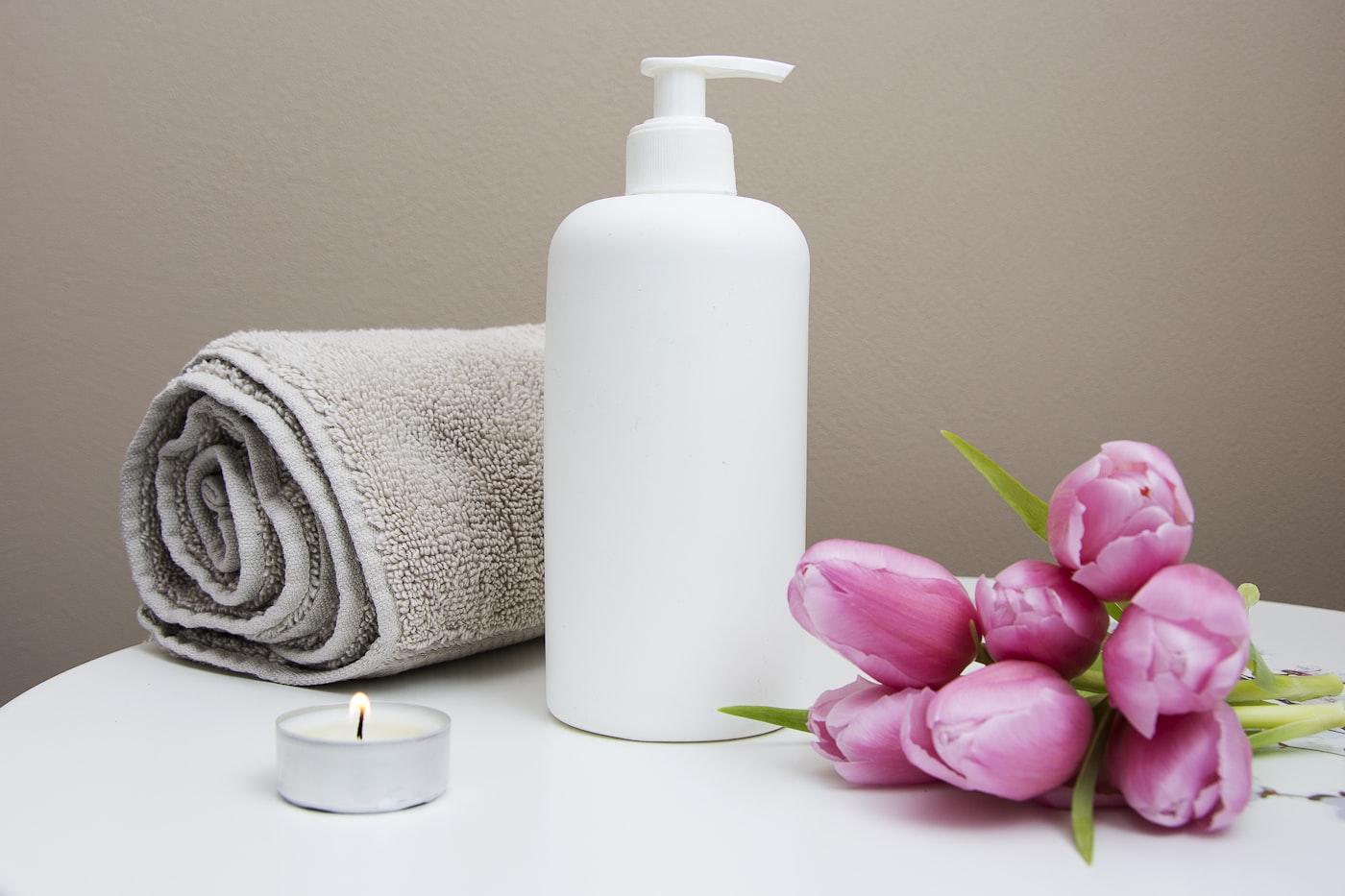A quiet treatment room with candles and soft light